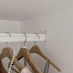 White Minimalist Double-Door Wardrobe with Hanging Section and Organized Storage